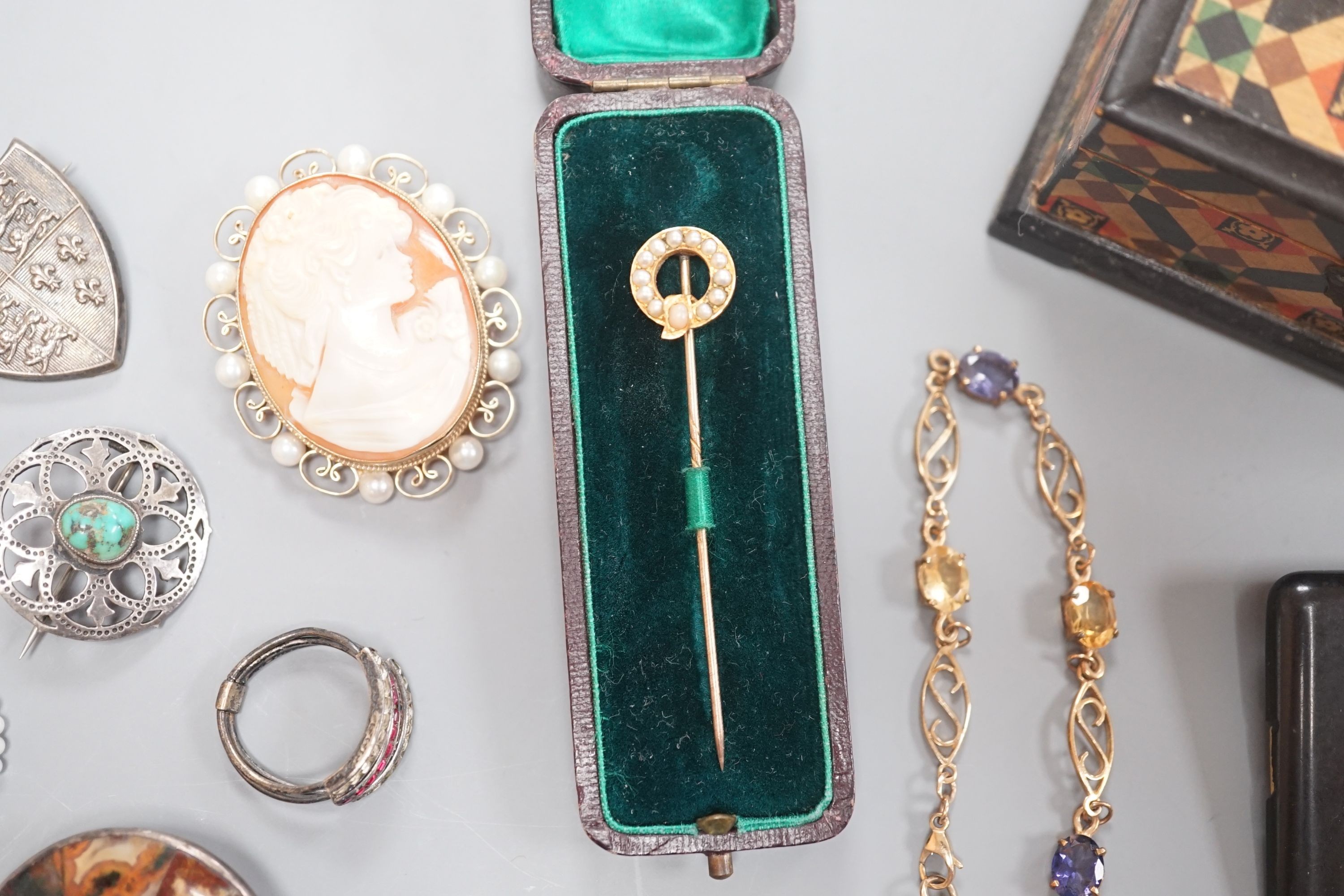 A small group of Victorian and later jewellery, including seed pearl set stick pin, 9ct and gem set bracelet, hardstone brooch, a pair of early 20th century Murrle Bennett & Co, 950 white metal and amethyst set drop earr